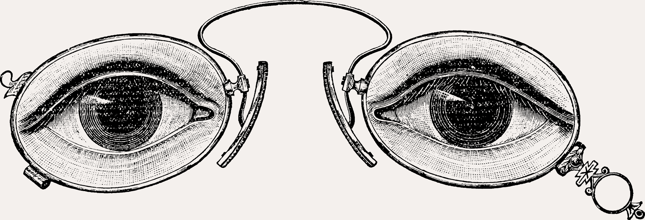 Etched lorgnette with eye illustrations in each lens.