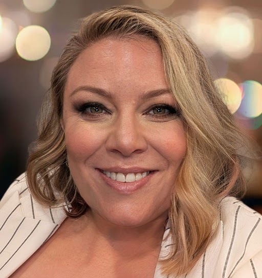 Amy Coleman Profile photo of Amy Coleman smiling in front of a bokeh background.